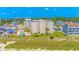 Aerial view of a condo complex shows the pool, parking, and surrounding residential neighborhood at 4525 S Ocean Blvd. # 406, North Myrtle Beach, SC 29582