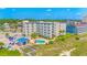 Stunning aerial view of the oceanfront resort showcasing a pool, parking, and well-maintained grounds at 4525 S Ocean Blvd. # 406, North Myrtle Beach, SC 29582