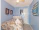 Charming bedroom with blue walls, coastal decor, and a comfortable bed with fresh towels at 4525 S Ocean Blvd. # 406, North Myrtle Beach, SC 29582
