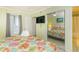 Relaxing bedroom with mirrored closet doors and a view into the bathroom at 4525 S Ocean Blvd. # 406, North Myrtle Beach, SC 29582