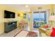 Relaxing living room with ocean view, cozy seating, and a flat-screen TV for ultimate comfort at 4525 S Ocean Blvd. # 406, North Myrtle Beach, SC 29582