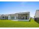 Backyard featuring a screened-in porch perfect for outdoor enjoyment and relaxation at 4555 Weekly Dr, Myrtle Beach, SC 29579
