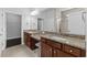 Elegant bathroom with dual vanity, granite countertops, and a tiled walk-in shower at 4555 Weekly Dr, Myrtle Beach, SC 29579