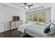 Bright bedroom with a cozy bed, a ceiling fan and a large window offering natural light at 4555 Weekly Dr, Myrtle Beach, SC 29579