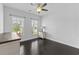 Bedroom with wood floors, a ceiling fan, and windows for natural light at 4555 Weekly Dr, Myrtle Beach, SC 29579