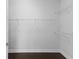 Walk-in closet with built-in wire shelving and dark wood floors, great for storage at 4555 Weekly Dr, Myrtle Beach, SC 29579