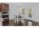 Cozy dining area with a modern chandelier and access to the backyard through a glass door at 4555 Weekly Dr, Myrtle Beach, SC 29579