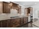 Gourmet kitchen with granite countertops, custom cabinetry, stainless steel appliances, and a gas cooktop at 4555 Weekly Dr, Myrtle Beach, SC 29579