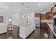 Kitchen with island and bar stool seating, stainless steel appliances, and hardwood floors at 4555 Weekly Dr, Myrtle Beach, SC 29579