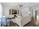 Bright living room features a large entertainment center, comfortable seating and a ceiling fan at 4555 Weekly Dr, Myrtle Beach, SC 29579