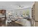 Bright living room featuring hardwood floors, neutral paint, and large windows with natural light at 4555 Weekly Dr, Myrtle Beach, SC 29579