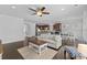 Open-concept living space with a kitchen island, dining area and comfortable seating at 4555 Weekly Dr, Myrtle Beach, SC 29579