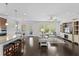 Open-concept living space with a kitchen island, dining area and large windows at 4555 Weekly Dr, Myrtle Beach, SC 29579