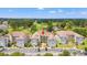 Aerial view of condo buildings, parking lot, green trees and a golf course at 4705 Wild Iris Dr. # 201, Myrtle Beach, SC 29577