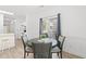 Dining area featuring a round table, chairs, and access to sliding glass doors at 4705 Wild Iris Dr. # 201, Myrtle Beach, SC 29577