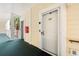 Condo entrance featuring a white door, an access to a walkway and railing at 4705 Wild Iris Dr. # 201, Myrtle Beach, SC 29577