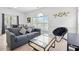 Comfortable living room with a plush sofa, modern decor, and lots of natural light at 4705 Wild Iris Dr. # 201, Myrtle Beach, SC 29577