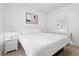Neutral main bedroom featuring white furniture and comfortable lighting at 4705 Wild Iris Dr. # 201, Myrtle Beach, SC 29577