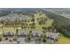 Aerial view of the condo complex overlooking a lush green golf course and waterway at 4878 Luster Leaf Circle # 102, Myrtle Beach, SC 29577