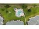 Aerial shot of community pool with ample lounge chairs and a beautiful surrounding landscape at 4878 Luster Leaf Circle # 102, Myrtle Beach, SC 29577