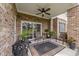 Cozy back porch with brick columns, patio furniture, and a peaceful setting at 4878 Luster Leaf Circle # 102, Myrtle Beach, SC 29577