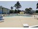 Inviting community pool area with ample seating and well-kept landscaping at 4878 Luster Leaf Circle # 102, Myrtle Beach, SC 29577