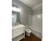 Modern bathroom with marble vanity top, stylish fixtures, and tiled shower/tub at 493 Emerson Dr., Myrtle Beach, SC 29579
