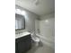 Bathroom with gray vanity, tub, and shower combination offers a clean and functional space at 493 Emerson Dr., Myrtle Beach, SC 29579