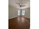 A bedroom with laminate floors and two large windows allows for plenty of natural light and comfort at 493 Emerson Dr., Myrtle Beach, SC 29579