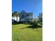 Charming two-story home with a well-maintained lawn and beautiful landscaping at 493 Emerson Dr., Myrtle Beach, SC 29579