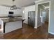 Modern kitchen featuring stainless steel appliances, wood floors, and a large center island at 493 Emerson Dr., Myrtle Beach, SC 29579