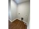 The laundry room has neutral walls, wood flooring, and washer/dryer hookups for convenience at 493 Emerson Dr., Myrtle Beach, SC 29579