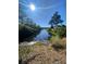 Beautiful water view with mature trees, blue sky, and nature surroundings, offering tranquility and scenic beauty at 493 Emerson Dr., Myrtle Beach, SC 29579