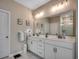Bathroom with double vanity, large mirror, and a view of the walk-in shower at 5013 Sassari St., Myrtle Beach, SC 29579