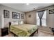 Cozy bedroom with neutral walls, a green comforter, and a window with natural light at 5013 Sassari St., Myrtle Beach, SC 29579