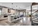 Large kitchen with an island, stainless steel appliances, and bar seating overlooking the living area at 5013 Sassari St., Myrtle Beach, SC 29579