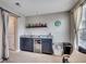 A well-appointed living room features a granite wet bar, mini-fridge, and decor at 5013 Sassari St., Myrtle Beach, SC 29579