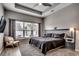Comfortable main bedroom with a king bed, ceiling fan, and natural light from a large window at 5013 Sassari St., Myrtle Beach, SC 29579
