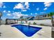 The backyard features a sparkling pool, a pergola, and a white vinyl privacy fence at 5013 Sassari St., Myrtle Beach, SC 29579