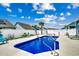 This backyard features a sparkling pool, a pool deck, and a privacy fence at 5013 Sassari St., Myrtle Beach, SC 29579