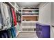 Walk-in closet with organized shelves, hanging rods, drawers, and hardwood flooring at 5013 Sassari St., Myrtle Beach, SC 29579