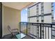 Balcony overlooking the ocean and a neighboring building with a table and chair at 5310 N Ocean Blvd. # Ph 6 1506, Myrtle Beach, SC 29577