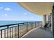 Spacious balcony with seating offers stunning views of the beach and ocean, perfect for relaxing at 5310 N Ocean Blvd. # Ph 6 1506, Myrtle Beach, SC 29577