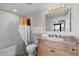 Bright bathroom featuring a vanity with a granite countertop and a shower-tub combo with a stylish shower curtain at 5310 N Ocean Blvd. # Ph 6 1506, Myrtle Beach, SC 29577