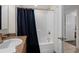 Bathroom with granite countertop, single sink, and a shower tub with a dark blue curtain at 5310 N Ocean Blvd. # Ph 6 1506, Myrtle Beach, SC 29577