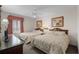 Comfortable bedroom with two beds, framed artwork, a ceiling fan, and a window with stylish valance at 5310 N Ocean Blvd. # Ph 6 1506, Myrtle Beach, SC 29577