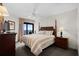 Comfortable bedroom with a queen sized bed and ocean view balcony access at 5310 N Ocean Blvd. # Ph 6 1506, Myrtle Beach, SC 29577