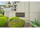Building signage for 'South Wind on the Ocean' surrounded by lush greenery, enhancing the entrance appeal at 5310 N Ocean Blvd. # Ph 6 1506, Myrtle Beach, SC 29577