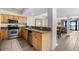 Bright kitchen features stainless steel appliances and granite countertops with easy access to the living area at 5310 N Ocean Blvd. # Ph 6 1506, Myrtle Beach, SC 29577