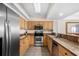 Well-equipped kitchen with stainless steel appliances, ample counter space, and wooden cabinets at 5310 N Ocean Blvd. # Ph 6 1506, Myrtle Beach, SC 29577